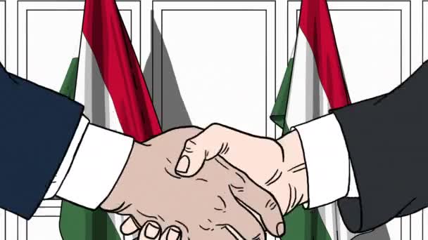 Empresarios o políticos se dan la mano contra las banderas de Hungría. Reunión oficial o animación de dibujos animados relacionados con la cooperación — Vídeos de Stock