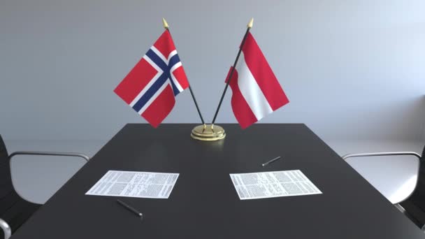 Flaggen Norwegens und Österreichs und Papiere auf dem Tisch. Verhandlungen und die Unterzeichnung eines internationalen Abkommens. konzeptionelle 3D-Animation — Stockvideo