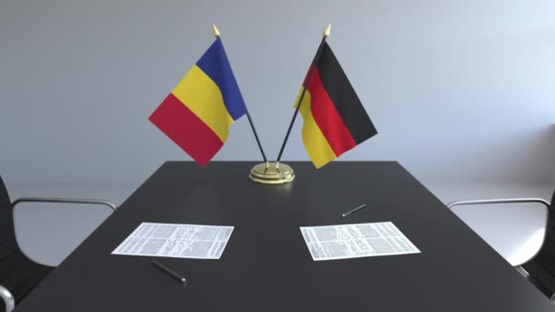 Bandiere di Romania e Germania e documenti sul tavolo. Negoziati e firma di un accordo internazionale. Animazione 3D concettuale — Video Stock