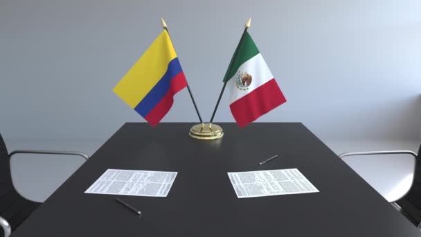 Bayraklar, Kolombiya ve Meksika ve kağıtları masaya. Müzakereler ve uluslararası bir anlaşma imzalama. Kavramsal 3d animasyon — Stok video