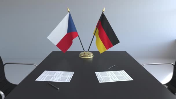 Flaggor av Tjeckien och Tyskland och papper på bordet. Förhandlingarna och underteckna internationella avtal. Konceptuell 3d-animering — Stockvideo