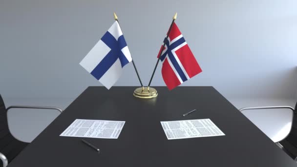 Banderas de Finlandia y Noruega y documentos sobre la mesa. Negociaciones y firma de un acuerdo internacional. Animación 3D conceptual — Vídeos de Stock