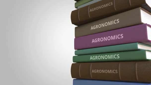 Stapel boeken op Agronomics, loopbare 3d animatie — Stockvideo