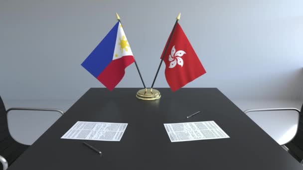 Lijst van vlaggen van Filipijnse en Hong Kong en papieren op de tafel. Onderhandelingen en ondertekening van een internationale overeenkomst. Conceptuele 3d animatie — Stockvideo