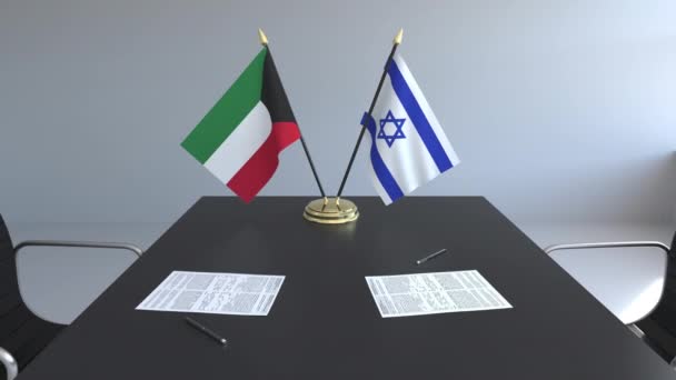 Drapeaux du Koweït et d'Israël et papiers sur la table. Négociations et signature d'un accord international. Animation 3D conceptuelle — Video