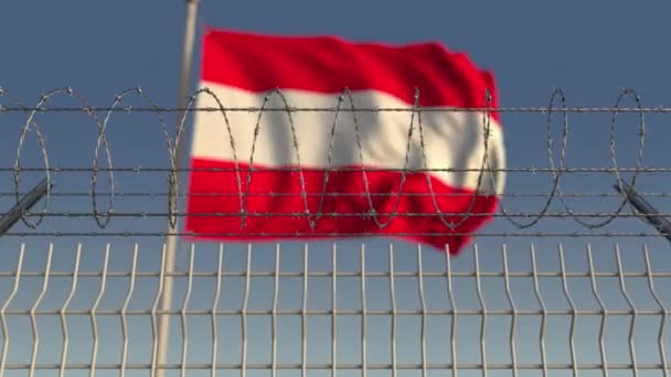 Bandeira de acenar desfocada da Áustria atrás da cerca de arame farpado. Loopable animação 3D — Vídeo de Stock