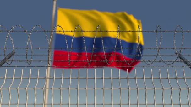 Blurred waving flag of Colombia behind barbed wire fence. Loopable 3D animation — Stock Video