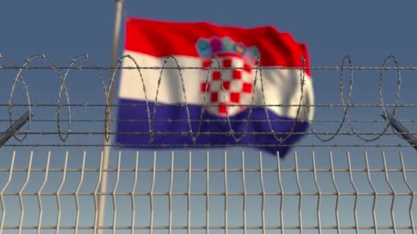 Wazig wapperende vlag van Kroatië achter prikkeldraad hek. Loopbare 3d animatie — Stockvideo