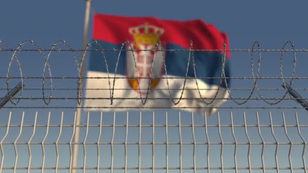 Defocused waving flag of Serbia behind barbed wire fence. Loopable 3D animation — Stock Video