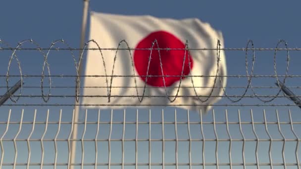 Bandeira acenando borrada do Japão atrás da cerca de arame farpado. Loopable animação 3D — Vídeo de Stock