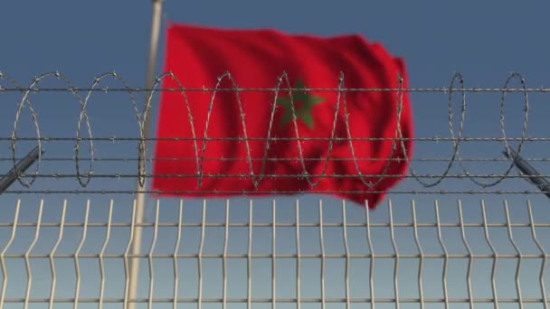 Bandeira acenando desfocada de Marrocos atrás da cerca de arame farpado. Loopable animação 3D — Vídeo de Stock