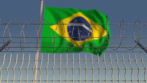 Prikkeldraad tegen zwaaien vlag van Brazilië. Loopbare 3d animatie — Stockvideo