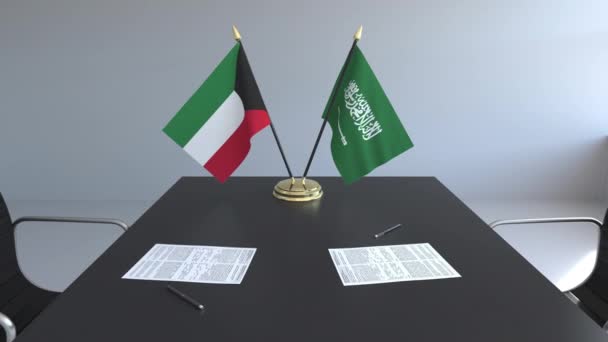 Zászlók, Kuvait, Szaúd-Arábia és papírok az asztalon. A tárgyalások és a nemzetközi megállapodást. Fogalmi 3d animáció — Stock videók