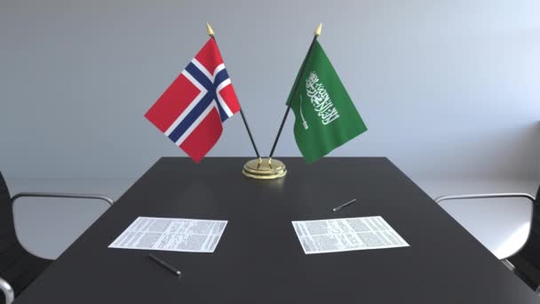 Bandeiras da Noruega e da Arábia Saudita e papéis na mesa. Negociações e assinatura de um acordo internacional. Animação 3D conceitual — Vídeo de Stock