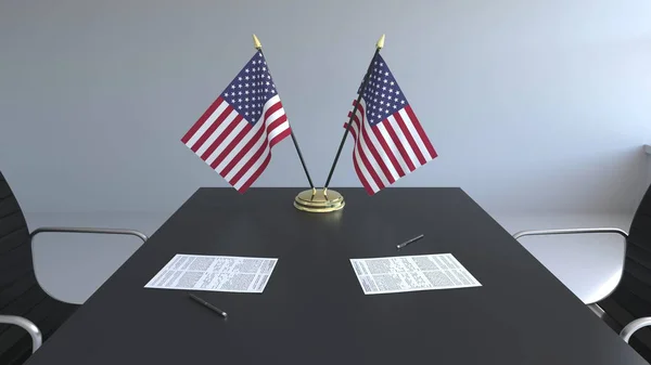 Σημαίες από τις Ηνωμένες Πολιτείες και τα χαρτιά στο τραπέζι. Οι διαπραγματεύσεις και η υπογραφή μιας συμφωνίας. Εννοιολογική 3d rendering — Φωτογραφία Αρχείου