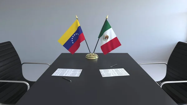 Flaggor av Venezuela och Mexico och papper på bordet. Förhandlingarna och underteckna internationella avtal. Konceptuell 3d-rendering — Stockfoto