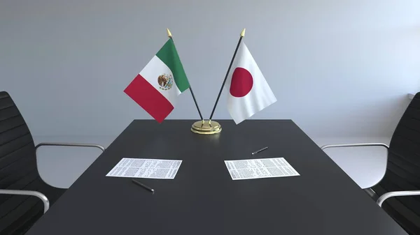 Banderas de México y Japón y papeles sobre la mesa. Negociaciones y firma de un acuerdo internacional. Renderizado 3D conceptual —  Fotos de Stock