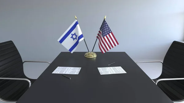 Bandiere di Israele e degli Stati Uniti e documenti sul tavolo. Negoziati e firma di un accordo internazionale. Rendering 3D concettuale — Foto Stock