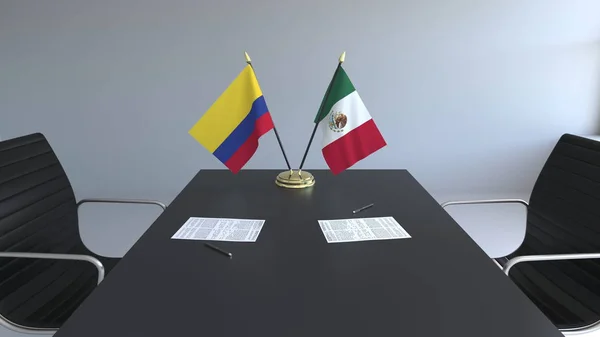 Flaggor av Colombia och Mexiko och papper på bordet. Förhandlingarna och underteckna internationella avtal. Konceptuell 3d-rendering — Stockfoto