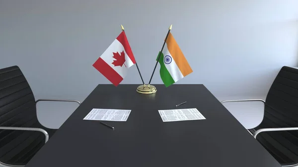 Flagi Kanady i Indii i dokumentacją na stole. Negocjacji i podpisywania umowy międzynarodowej. Konceptualna renderowania 3d — Zdjęcie stockowe