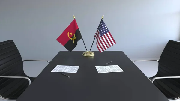 Flagi z Angola i Stany Zjednoczone i dokumentacją na stole. Negocjacji i podpisywania umowy międzynarodowej. Konceptualna renderowania 3d — Zdjęcie stockowe