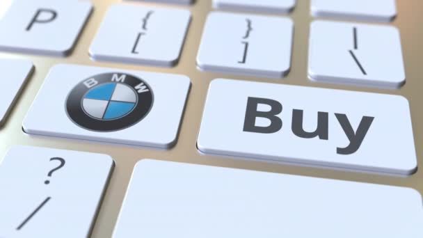 BMW company logo and Buy text on the keys of the computer keyboard, editorial conceptual animation — Stock Video