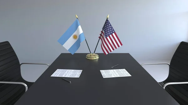 Lijst van vlaggen van Argentinië en de Verenigde Staten en de papieren op tafel. Onderhandelingen en ondertekening van een internationale overeenkomst. Conceptuele 3D-rendering — Stockfoto