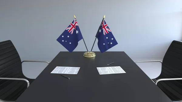 Flaggor av Australien och papper på bordet. Förhandlingarna och underteckna ett avtal. Konceptuell 3d-rendering — Stockfoto