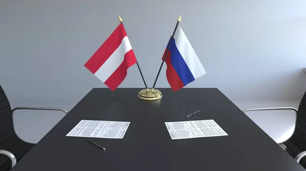 Bandeiras da Áustria e da Rússia e documentos sobre a mesa. Negociações e assinatura de um acordo internacional. Renderização 3D conceitual — Fotografia de Stock