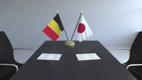 Прапори Бельгії та Японії і документи на столі. Переговорів і підписання міжнародного договору. Концептуальна 3d-рендерінг — стокове фото