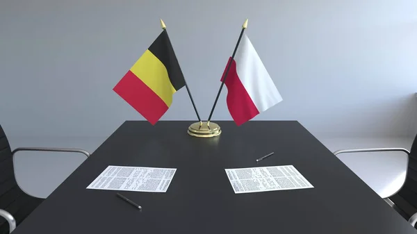 Zászlók, Belgium, Lengyelország és papírok az asztalon. A tárgyalások és a nemzetközi megállapodást. Konceptuális 3d-leképezés — Stock Fotó