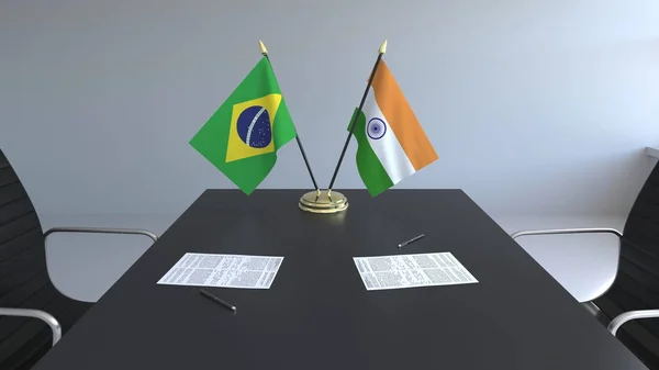 Флаги Бразилии и Индии и бумаги на столе. Переговоры и подписание международного соглашения. Концептуальная 3D рендеринг — стоковое фото