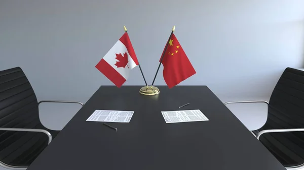 Lijst van vlaggen van Canada en China en papieren op de tafel. Onderhandelingen en ondertekening van een internationale overeenkomst. Conceptuele 3D-rendering — Stockfoto