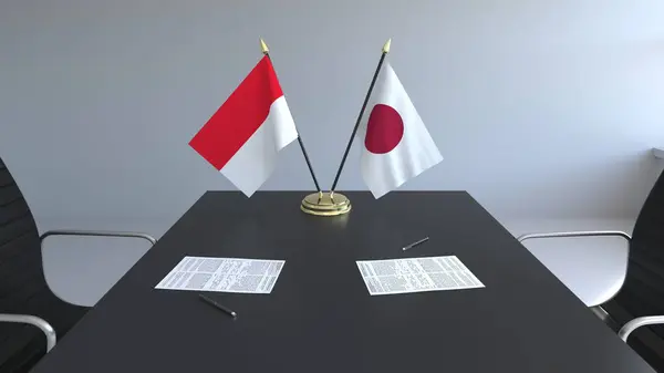 Σημαίες από την Ινδονησία, την Ιαπωνία και χαρτιά στο τραπέζι. Οι διαπραγματεύσεις και η υπογραφή μιας διεθνούς συμφωνίας. Εννοιολογική 3d rendering — Φωτογραφία Αρχείου