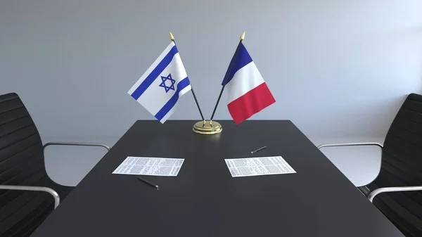 Drapeaux d'Israël et de France et papiers sur la table. Négociations et signature d'un accord international. rendu 3D conceptuel — Photo