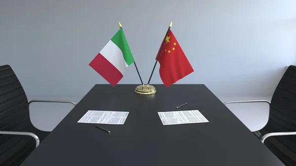 Flags of Italy and China and papers on the table. Negotiations and signing an international agreement. Conceptual 3D rendering