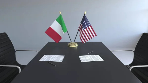 イタリアとアメリカ合衆国とテーブルの上の論文のフラグです。交渉と国際協定に署名します。概念 3 d レンダリング — ストック写真