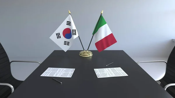 Bandeiras da Coreia do Sul e Itália e papéis na mesa. Negociações e assinatura de um acordo internacional. Renderização 3D conceitual — Fotografia de Stock