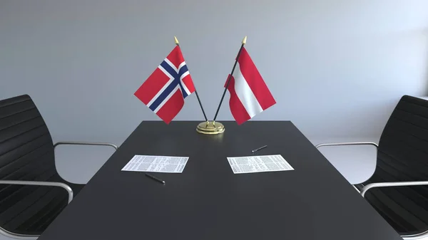 Flaggor av Norge och Österrike och papper på bordet. Förhandlingarna och underteckna internationella avtal. Konceptuell 3d-rendering — Stockfoto