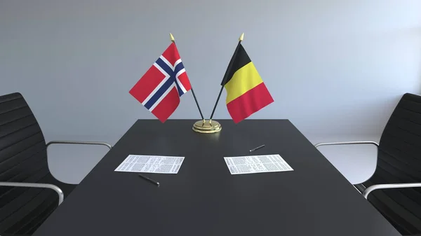 Flaggor av Norge och Belgien och papper på bordet. Förhandlingarna och underteckna internationella avtal. Konceptuell 3d-rendering — Stockfoto