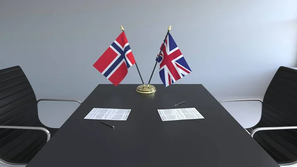 Zászlók, Norvégia és az Egyesült Királyság és a papírokat az asztalon. A tárgyalások és a nemzetközi megállapodást. Konceptuális 3d-leképezés — Stock Fotó