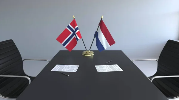 Flaggor av Norge och Nederländerna och papper på bordet. Förhandlingarna och underteckna internationella avtal. Konceptuell 3d-rendering — Stockfoto