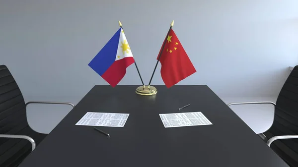 Bendera Filipina dan Cina dan kertas di atas meja. Negosiasi dan penandatanganan perjanjian internasional. Pencitraan 3D konseptual — Stok Foto