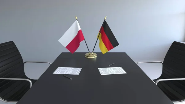 Bendera Polandia dan Jerman dan kertas di atas meja. Negosiasi dan penandatanganan perjanjian internasional. Pencitraan 3D konseptual — Stok Foto