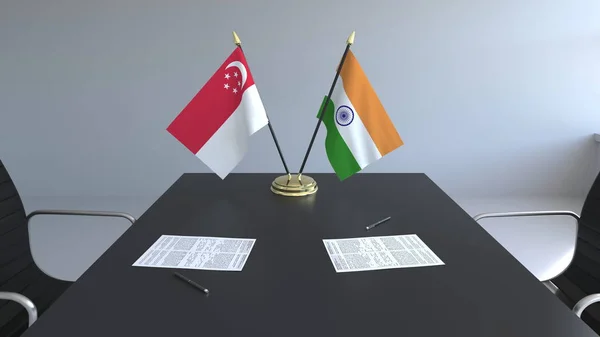 Flaggor av Singapore och Indien och papper på bordet. Förhandlingarna och underteckna internationella avtal. Konceptuell 3d-rendering — Stockfoto
