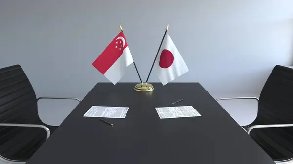 Flaggor av Singapore och Japan och papper på bordet. Förhandlingarna och underteckna internationella avtal. Konceptuell 3d-rendering — Stockfoto