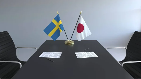 Bandeiras da Suécia e do Japão e papéis na mesa. Negociações e assinatura de um acordo internacional. Renderização 3D conceitual — Fotografia de Stock