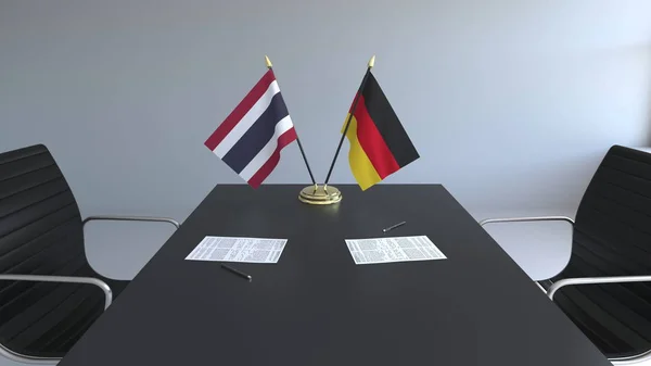 Tayland ve Almanya ve kağıtları masaya bayrakları. Müzakereler ve uluslararası bir anlaşma imzalama. Kavramsal 3d render — Stok fotoğraf