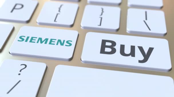 Siemens логотип компанії та купити текст на клавішах комп'ютерної клавіатури, редакційна концептуальна анімація — стокове відео