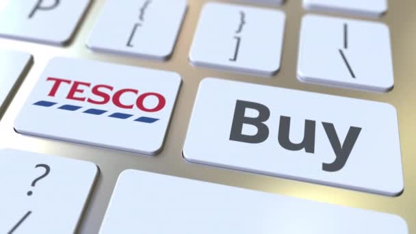 TESCO logotipo da empresa e comprar texto nas teclas do teclado do computador, animação conceitual editorial — Vídeo de Stock